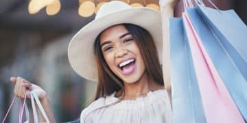 woman-shopping-bags-portrait-smile-city-carrying-gifts-discount-deal-purchase-happy-female-shopper-excited-winner-joyful-happiness-luxury-fashion-sale-urban-town